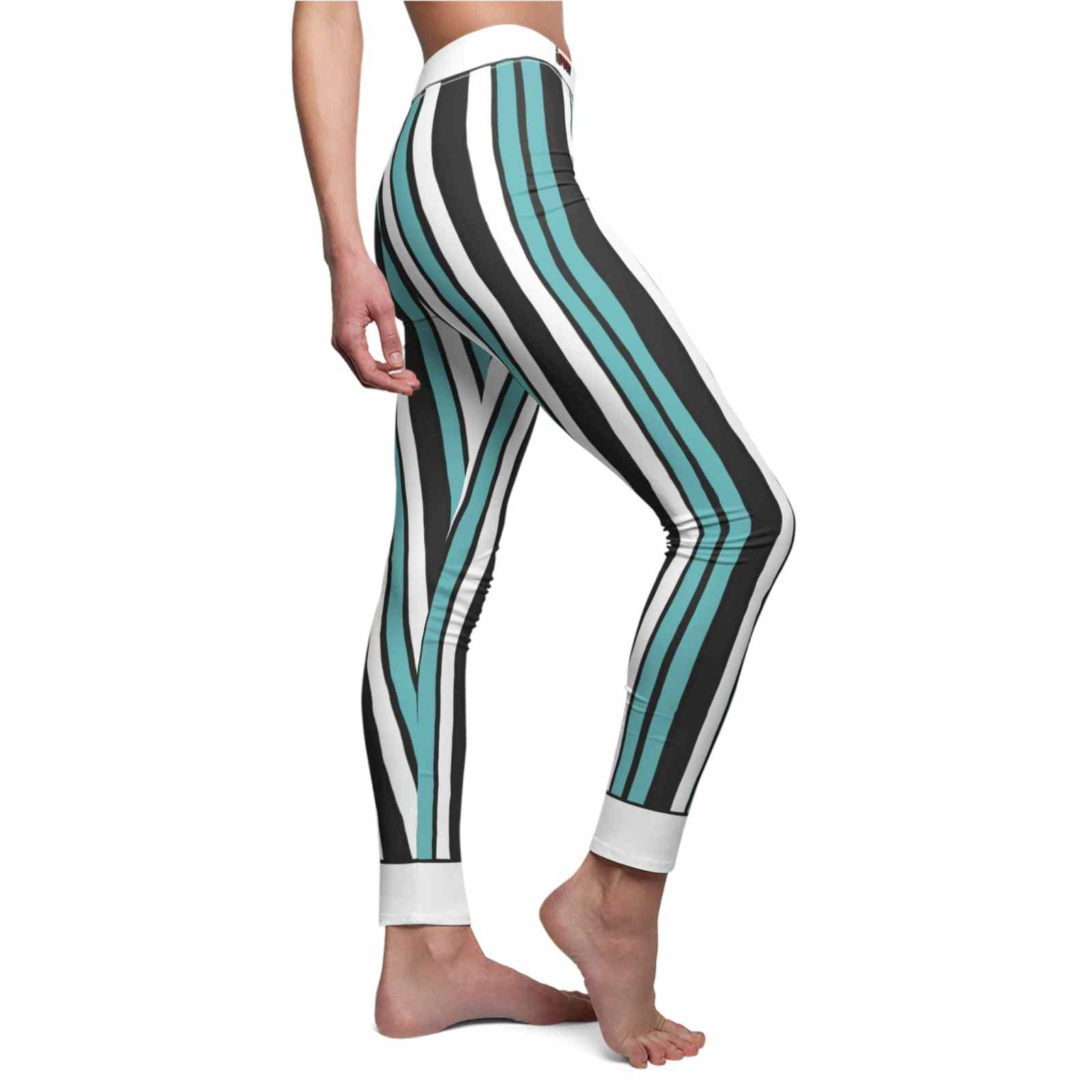 Women's Casual Striped Leggings, Trendy Yoga Pants, Fitness Wear, Lounge Pants, Activewear for Women. Showcasing a stylish side profile, these statement leggings feature a unique striped design, ideal for sport-luxe aesthetics. Crafted as high-waist, squat-proof leggings, they offer 4-way stretch and compression for ultimate comfort. Perfect as seamless gym leggings or athleisure wear, they blend functionality with fashion seamlessly.