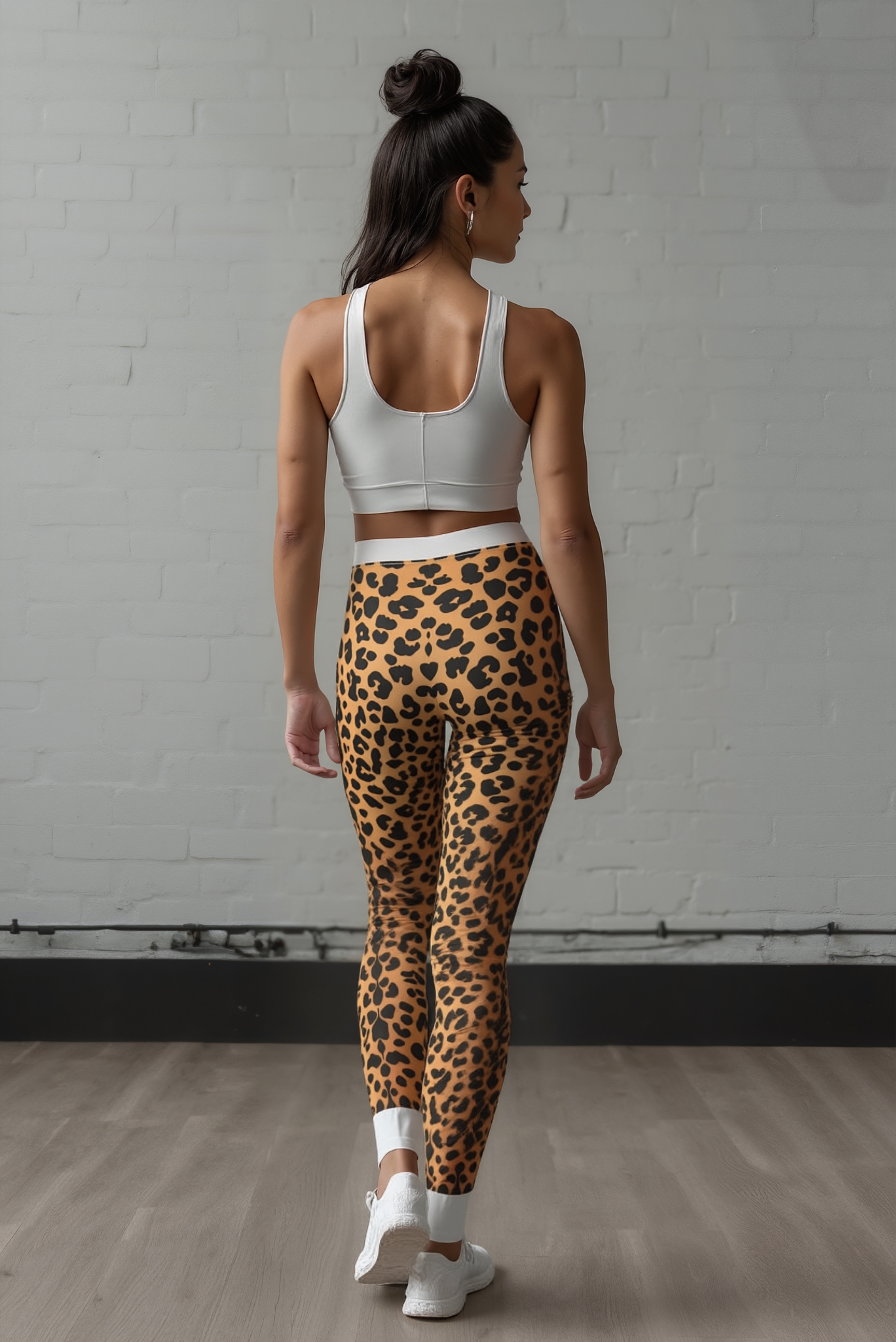Back view of a model wearing Wild Leopard Print Casual Leggings, a chic addition to any activewear collection. These designer leggings feature high-waist, compression material that is both squat-proof and breathable. Ideal for workouts or casual outings, these gym and sport-luxe leggings offer the perfect blend of style and functionality.