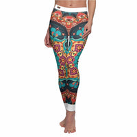 Close-up of beautifully designed vibrant bohemian print leggings, featuring a unique pattern by designer Christofffe. These high-waist leggings are perfect for yoga, providing compression and a 4-way stretch, ensuring comfort during any activity. The statement leggings are both fashionable and functional for your gym or casual wear.
