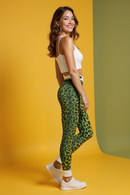Side view of a model in Vibrant Animal Print Leggings for Women, highlighting the trendy casual wear with a striking leopard pattern. These high-waist leggings are designed as compression and sport-luxe leggings, offering flexibility and comfort whether at the gym or on the go. A perfect choice for seamless athleisure wear.
