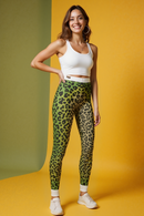 A model showcases Vibrant Animal Print Leggings for Women, featuring a stylish jungle print. These statement leggings are made with high-waist design, perfect for comfortable wear during workouts and in athleisure settings. Ideal as squat-proof leggings, these designer leggings combine sport-luxe style with 4-way stretch and seamless comfort, making them perfect gym leggings.