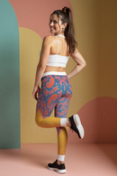 Back view of a model in stylish Women's Casual Leggings featuring a colorful pattern, ideal for casual outings or workouts. These sport-luxe leggings are designed with compression and high-waist support, making them great gym leggings for all fitness enthusiasts.