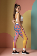 Profile view of a stylish model showcasing vibrant Women's Casual Leggings, perfect for a sporty look. These designer leggings feature a high-waist design and are squat-proof, ideal for gym sessions or casual outings. With 4-way stretch and compression features, they offer comfort in every activity, embodying the essence of athleisure leggings.
