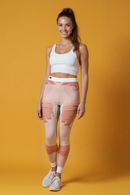 Model showcasing Chic Women's Casual Leggings with a smile, embodying confidence in these designer leggings. The leggings combine fashion and function with high-waist, seamless, and compression features, perfect for yoga or daily activities. Embrace sport-luxe style with these versatile, squat-proof gym leggings.