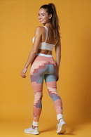 Back view of a model wearing Chic Women's Casual Leggings against a bright yellow background. These statement leggings are designed for movement and style, featuring a high-waist and squat-proof functionality that makes them ideal for both gym and casual wear. The 4-way stretch design enhances comfort and flexibility.