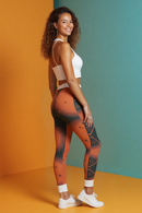 A confident woman wearing Stylish Women’s Casual Leggings that feature artistic prints. These high-waist leggings are designed for versatility, suitable for workout or casual wear. The compression leggings provide excellent support, making them ideal for any exercise routine. Enjoy the freedom of movement with these sport-luxe, squat-proof, 4-way stretch leggings that combine style and performance.
