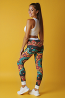 Vibrant Bohemian Print Leggings for Comfort & Style, showcasing a model in high-waist leggings that combine comfort and style. Perfect for yoga and casual wear, these statement leggings are designed for versatility and feature a unique artistic print by a renowned designer. Ideal for athleisure outfits, gym sessions, and dance attire, they are also squat-proof with 4-way stretch and compression qualities.