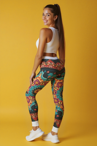 Vibrant Bohemian Print Leggings for Comfort & Style, showcasing a model in high-waist leggings that combine comfort and style. Perfect for yoga and casual wear, these statement leggings are designed for versatility and feature a unique artistic print by a renowned designer. Ideal for athleisure outfits, gym sessions, and dance attire, they are also squat-proof with 4-way stretch and compression qualities.