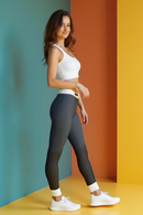 Model wearing the Designer Women's High Waist Yoga Leggings - Sustainable Premium Printed Leopard Tights during a yoga pose, demonstrating flexibility and style.