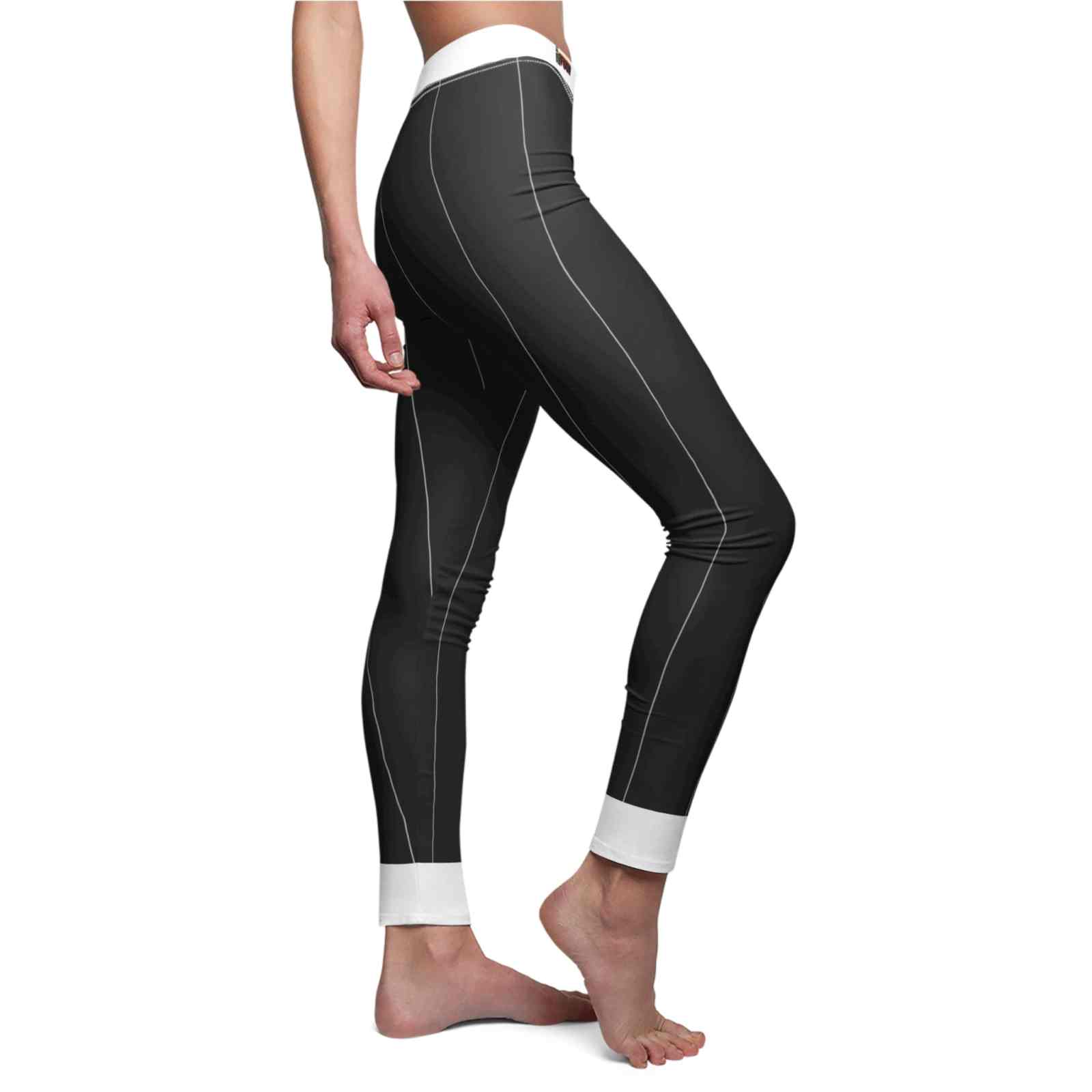 Close-up side profile of a woman modeling Women's Cut & Sew Casual Leggings (AOP) by Printify, highlighting the detailed stitching and design, paired with a minimal white top.