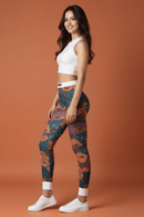 Side view of a model in casual leggings with a colorful mandala pattern, emphasizing stylish yoga pants for fitness enthusiasts.