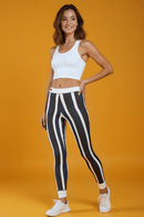 Model in Casual Striped Leggings posing confidently, showcasing the trendy and comfortable design ideal for yoga and casual lounging.
