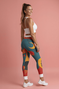 Vibrant Women's Casual Leggings - Bold Art Print, Yoga, Workout, Lounge, Gift for Her - model showcasing leggings with colorful abstract design on a pink background.